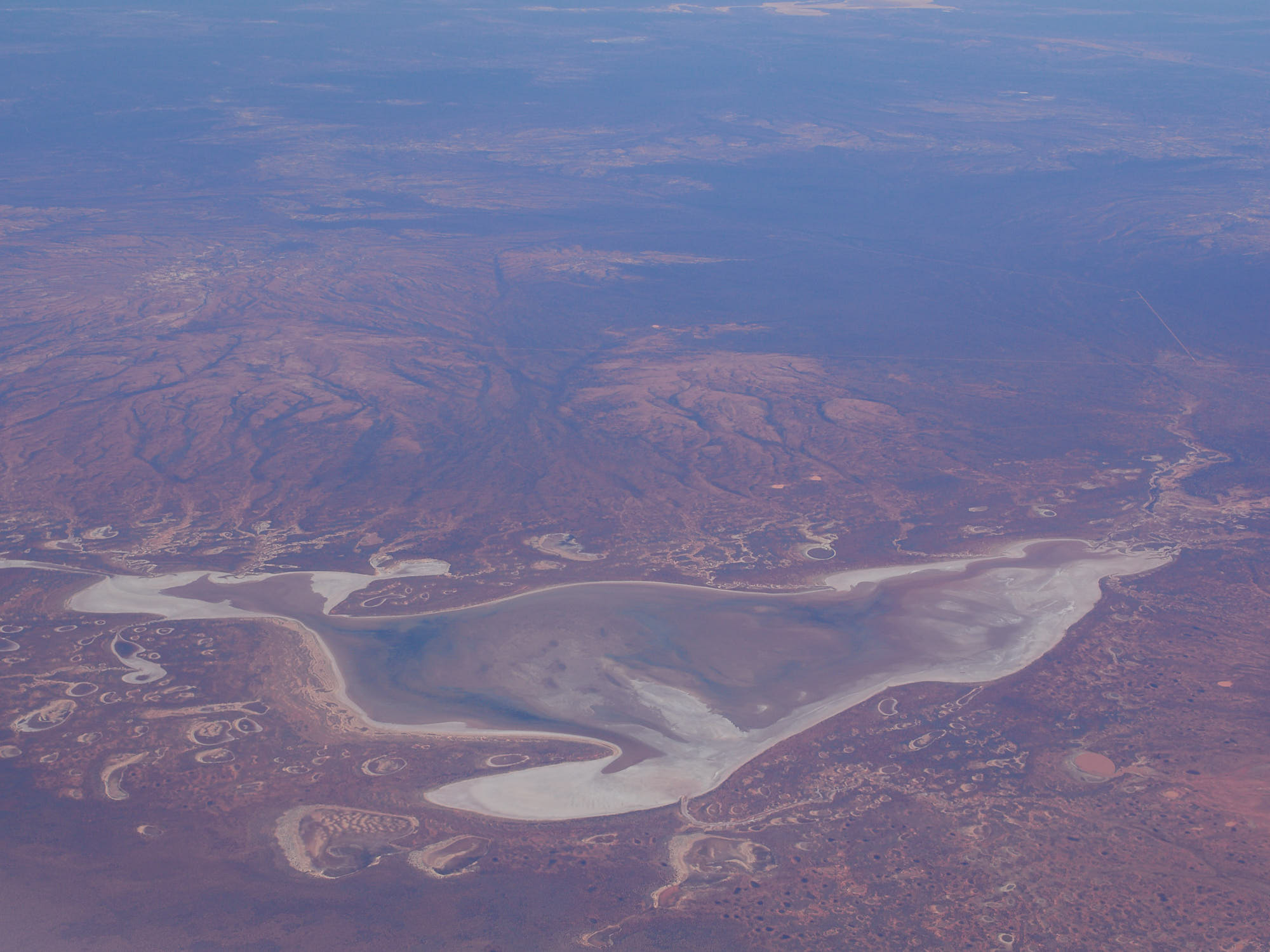 A view near Borodale Creek, Australia. The combination of airplane window plus atmospheric haze produced a very low contrast image with colour casts